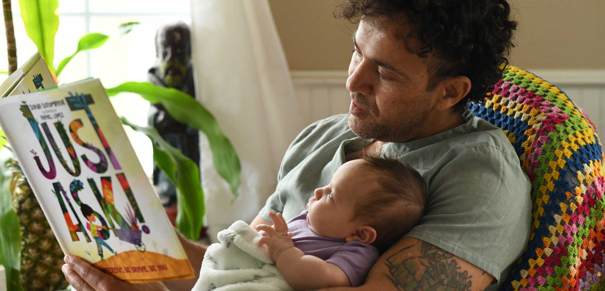 502-dad-reading-to-baby-17219299220406.jpg