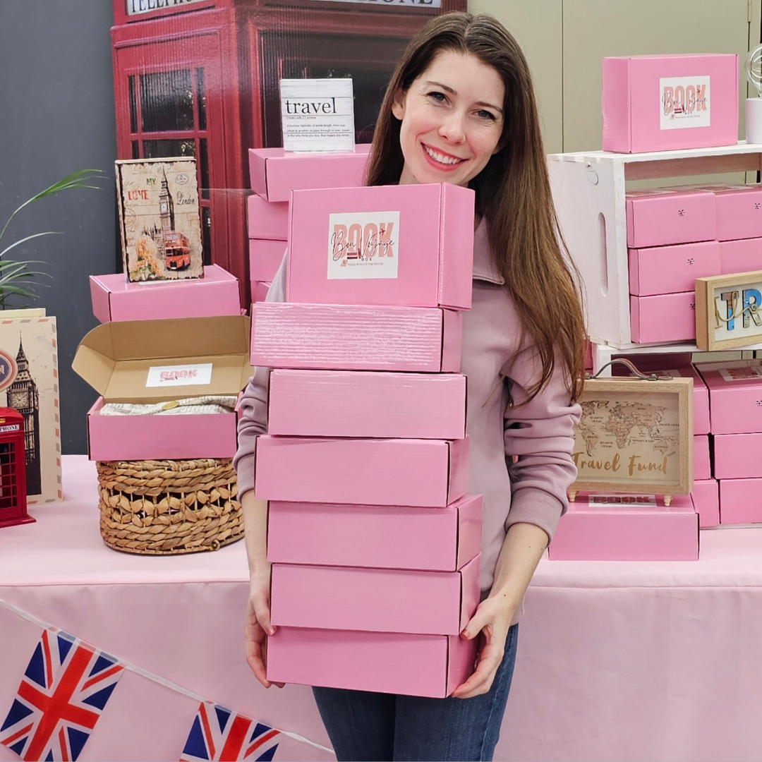 Sarah with a stack of boxes