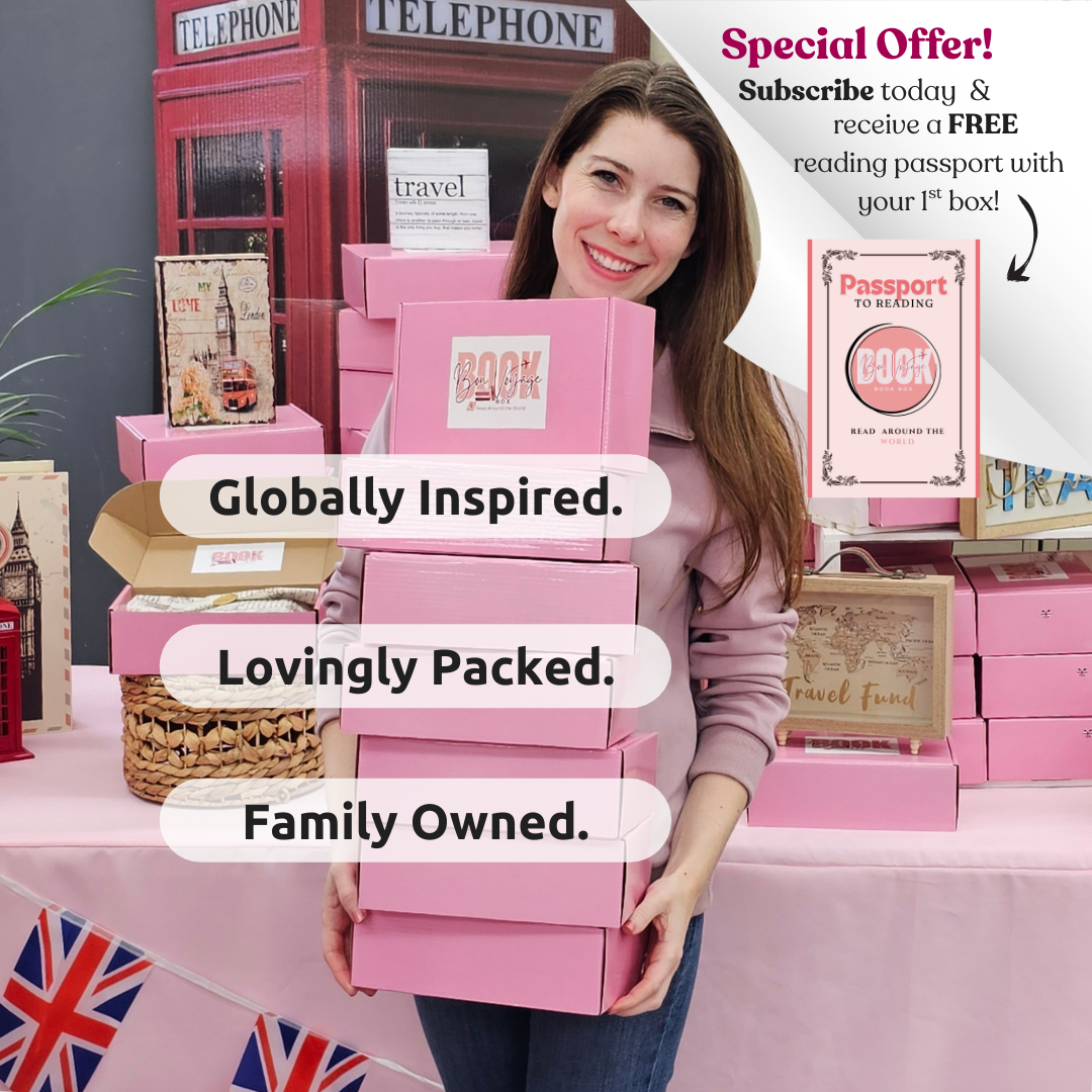 Woman holds a stack of pink book boxes