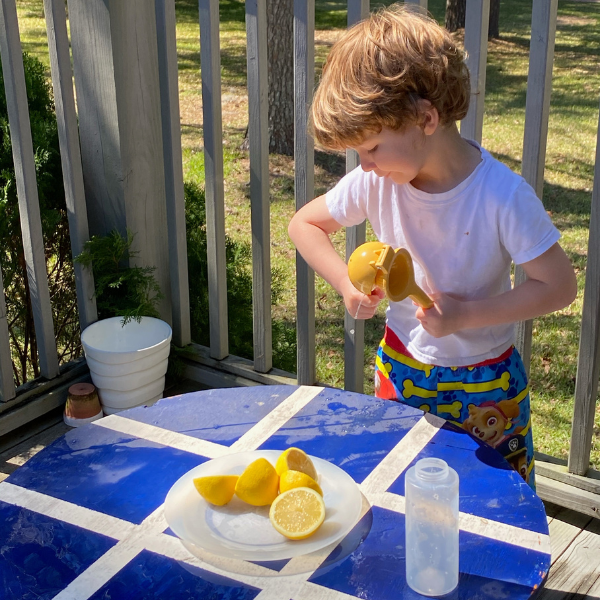 squishing lemons for sensory play