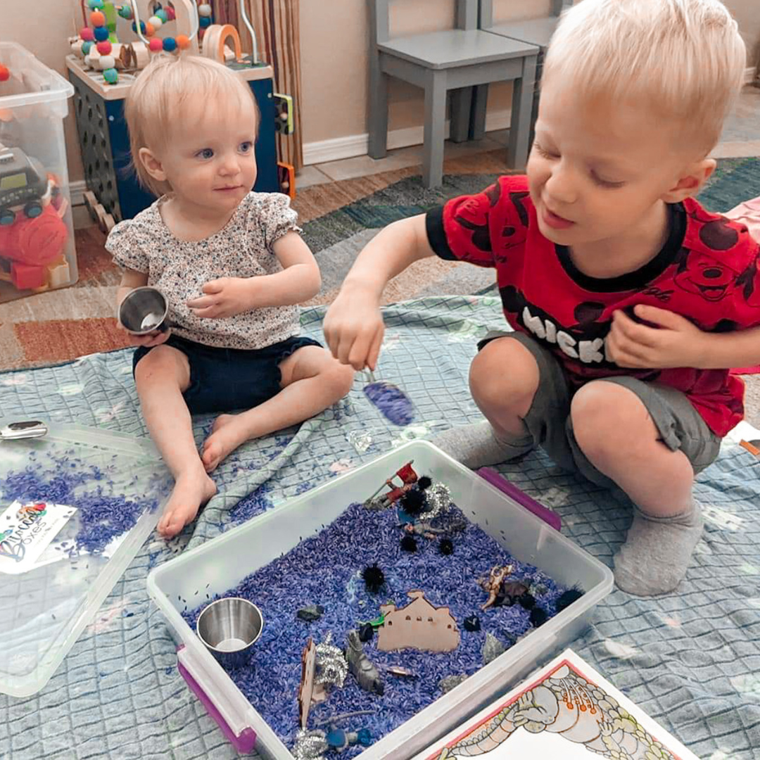 Brother and sister playing with their Knights and Dragons Sensory Kit