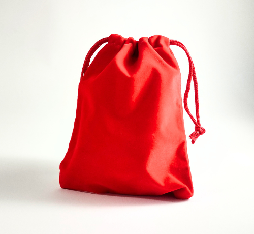 Game Design Brainstorm Blind Bag Red velvet bag filled with game pieces to create a game