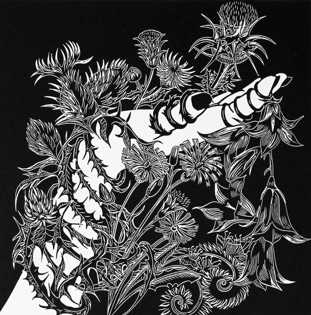 Black and white print of an outstretched hand, wrapped in thistles and flowers