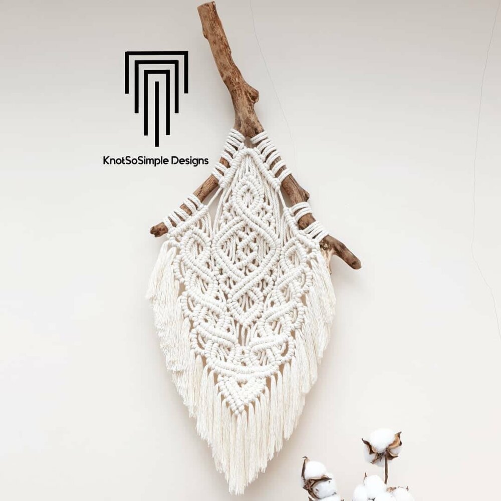 Image of a decorative macrame wall hanging.