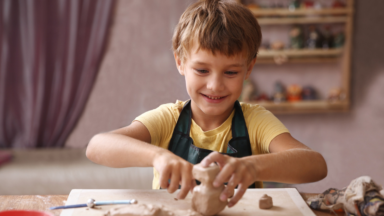 child modeling with clay