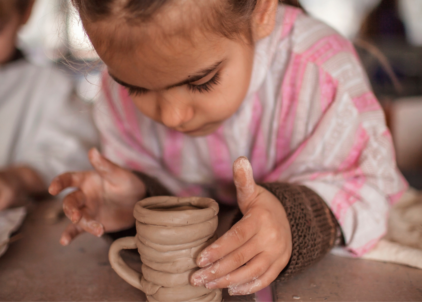 child modeling clay