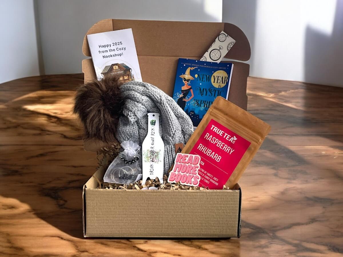 Peek Inside, New Year box New Year box, book, thermal bobble hat, bespoke bottle opener, raspberry tea