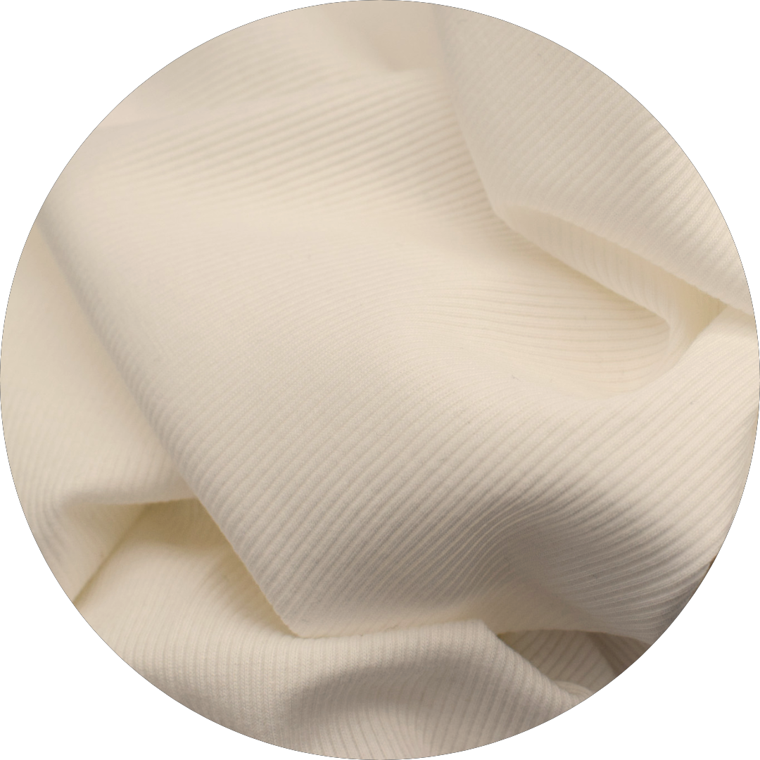 person in cream colored sleeveless v-neck rib knit top