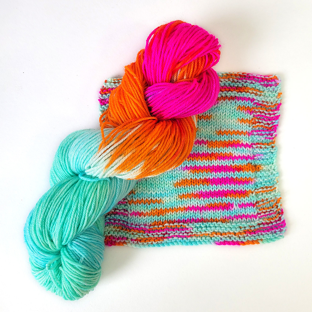 1062-painted-skein-with-knitted-square-1-17520553578644.jpg