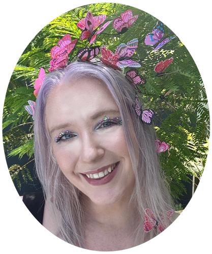 881-sheri-van-geest-headshot-enchanted-messenger-17633453641392.png