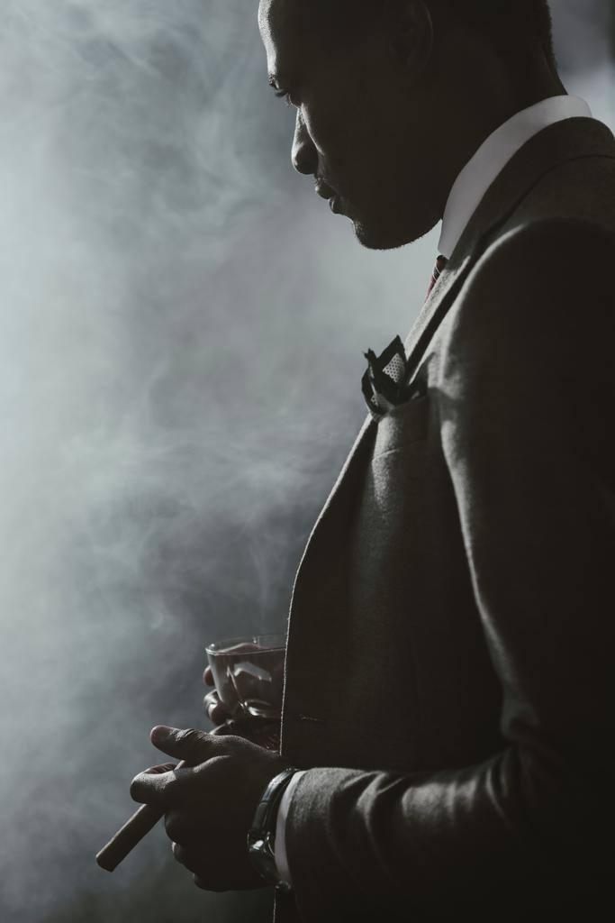 545-stock-photo-confident-african-american-businessman-in-suit-with-glass-of-whiskey-17118284392119.jpeg