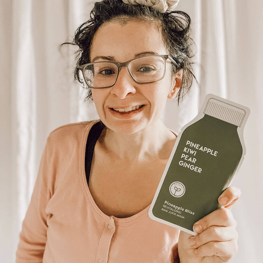 subscription box for toddlers and moms mom holding a face mask from her mommy and me subscription box for toddlers and moms