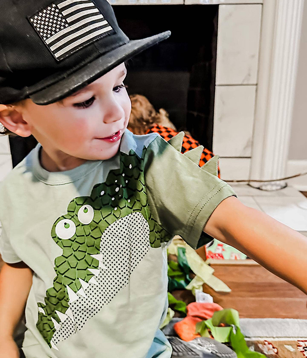little boy wearing a kids alligator t-shirt