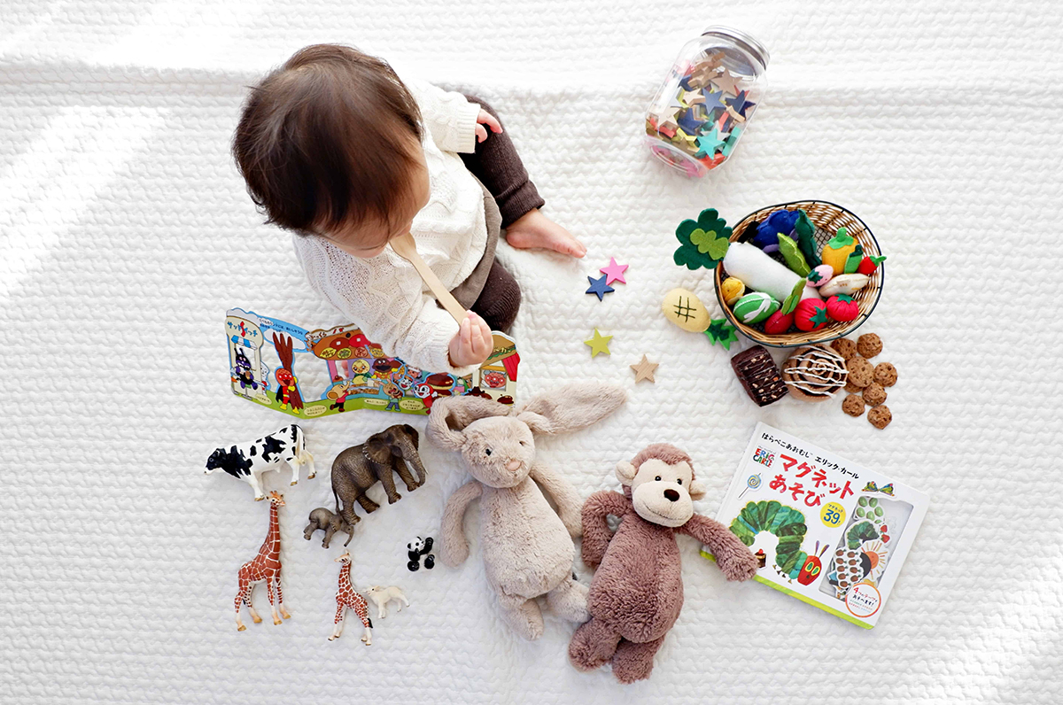 baby playing independently with toys