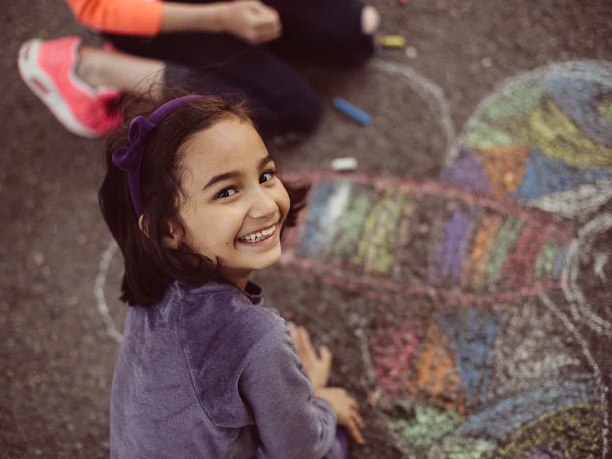 Kids Chalk Drawing On Driveway Stock Photo - Download Image Now