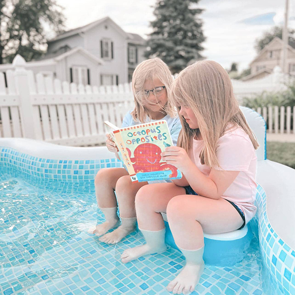 little girls reading a board book