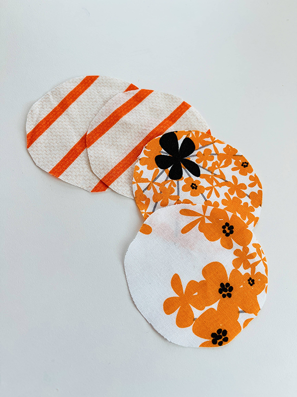 orange and beige floral print fabric rounds