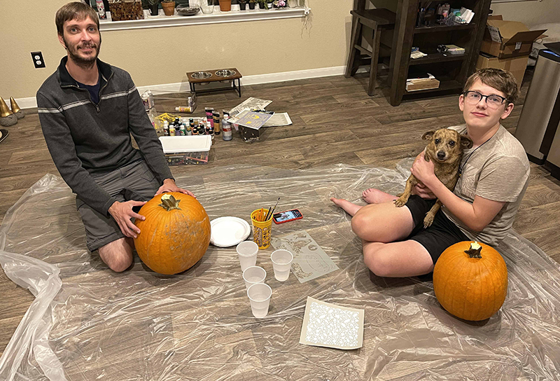 family pumpkin painting Thanksgiving tradition