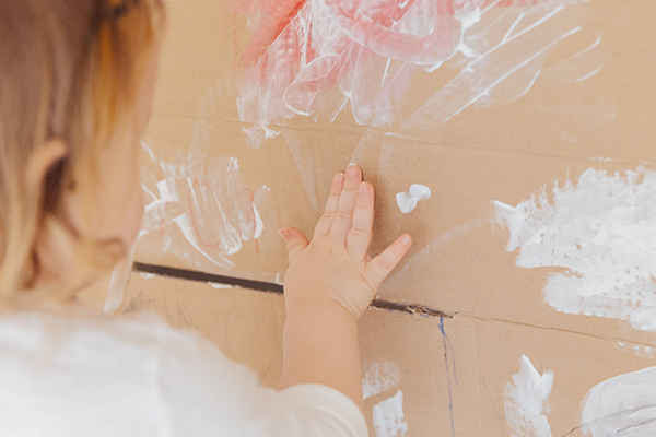 toddler girl finger painting