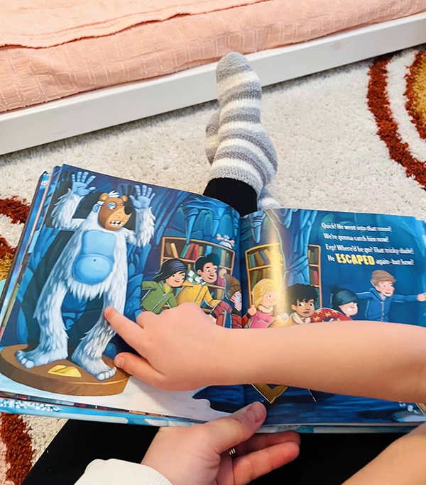 mom reading a book wearing fuzzy winter socks