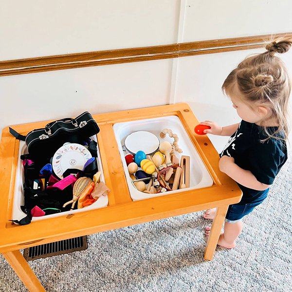 little girl unboxing June 2023 Howdy Baby gift boxes for toddlers