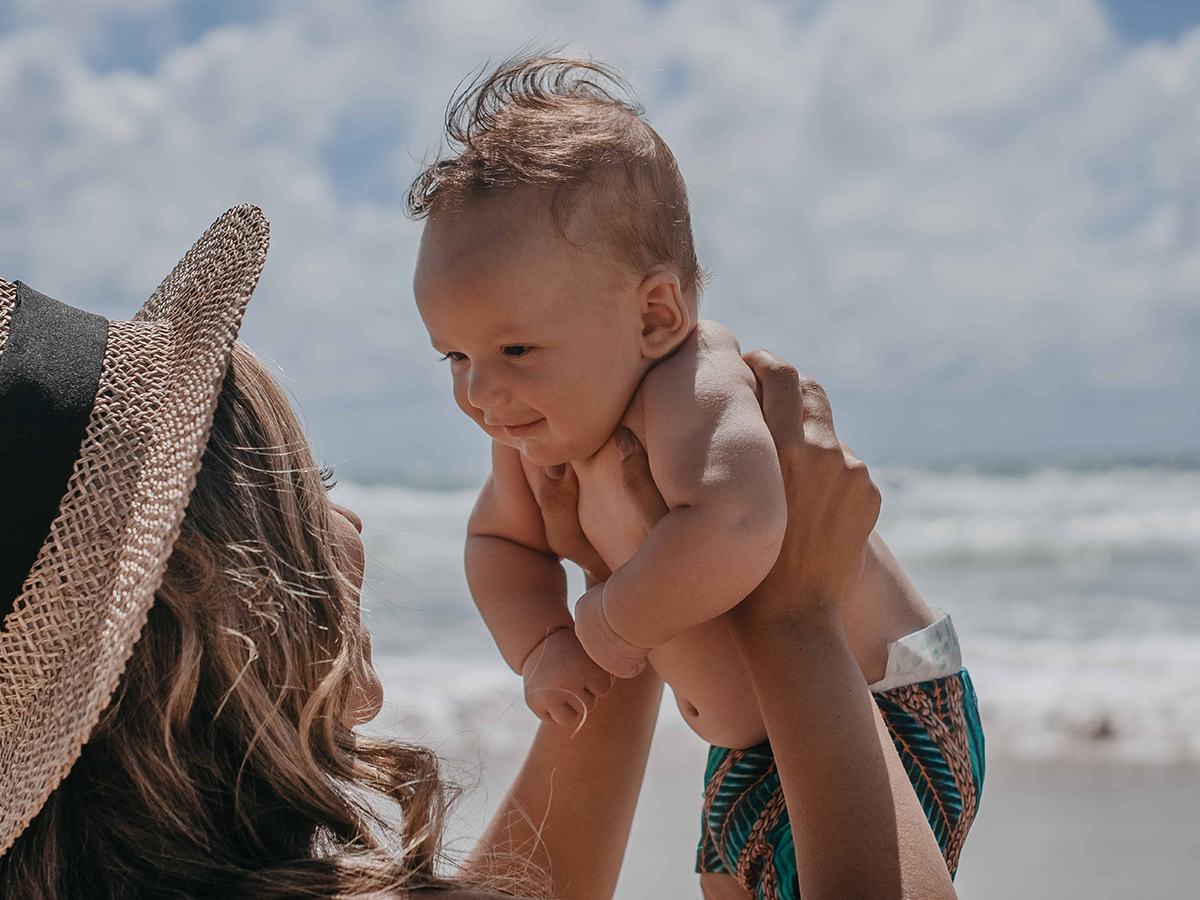 mom and baby on the beach