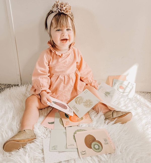 kindergarten girl playing and learning with sensory flash card manipulatives