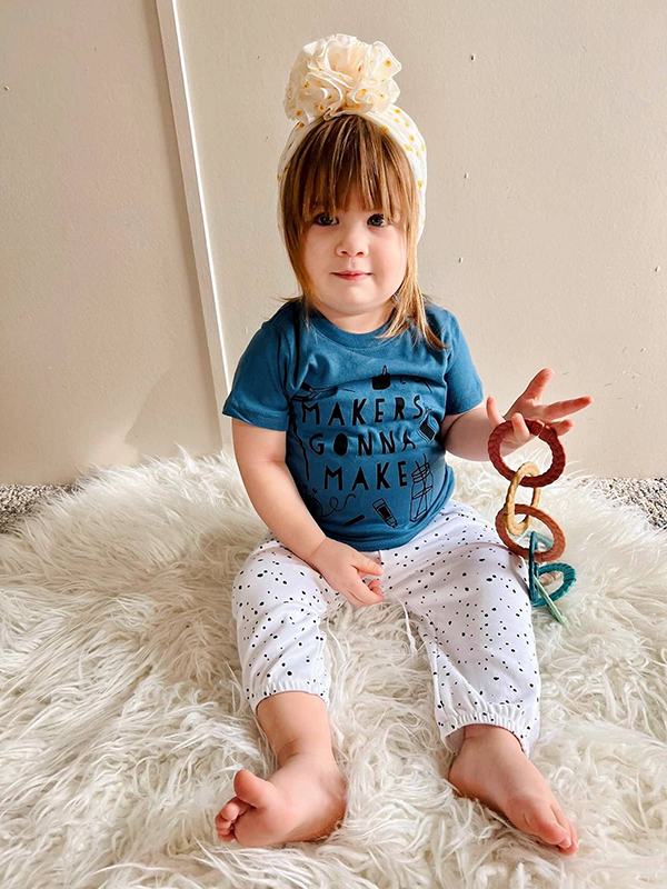 baby girl playing with linking toys