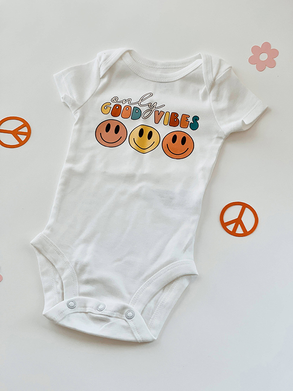 Good Vibes onesie from the May 2023 Howdy Baby maternity subscription box