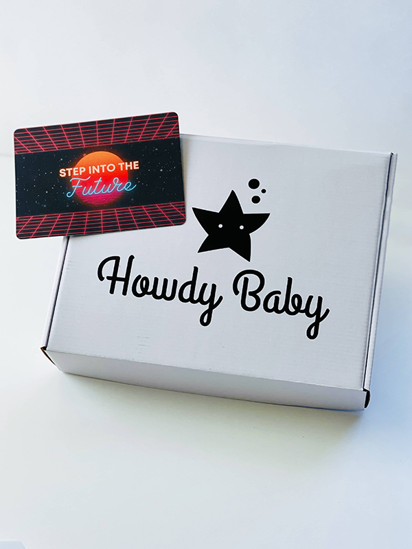 the January 2023 Howdy Baby Montessori inspired subscription box with white new year packaging