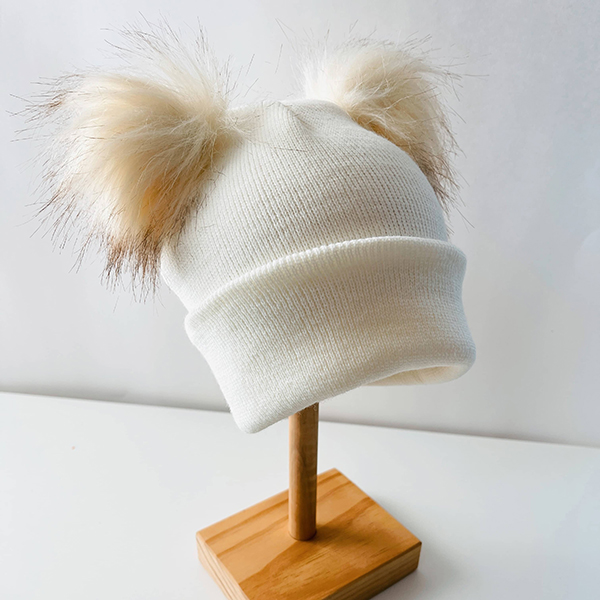winter pom pom hat from December 2023 Howdy Baby Box monthly gift box for kids