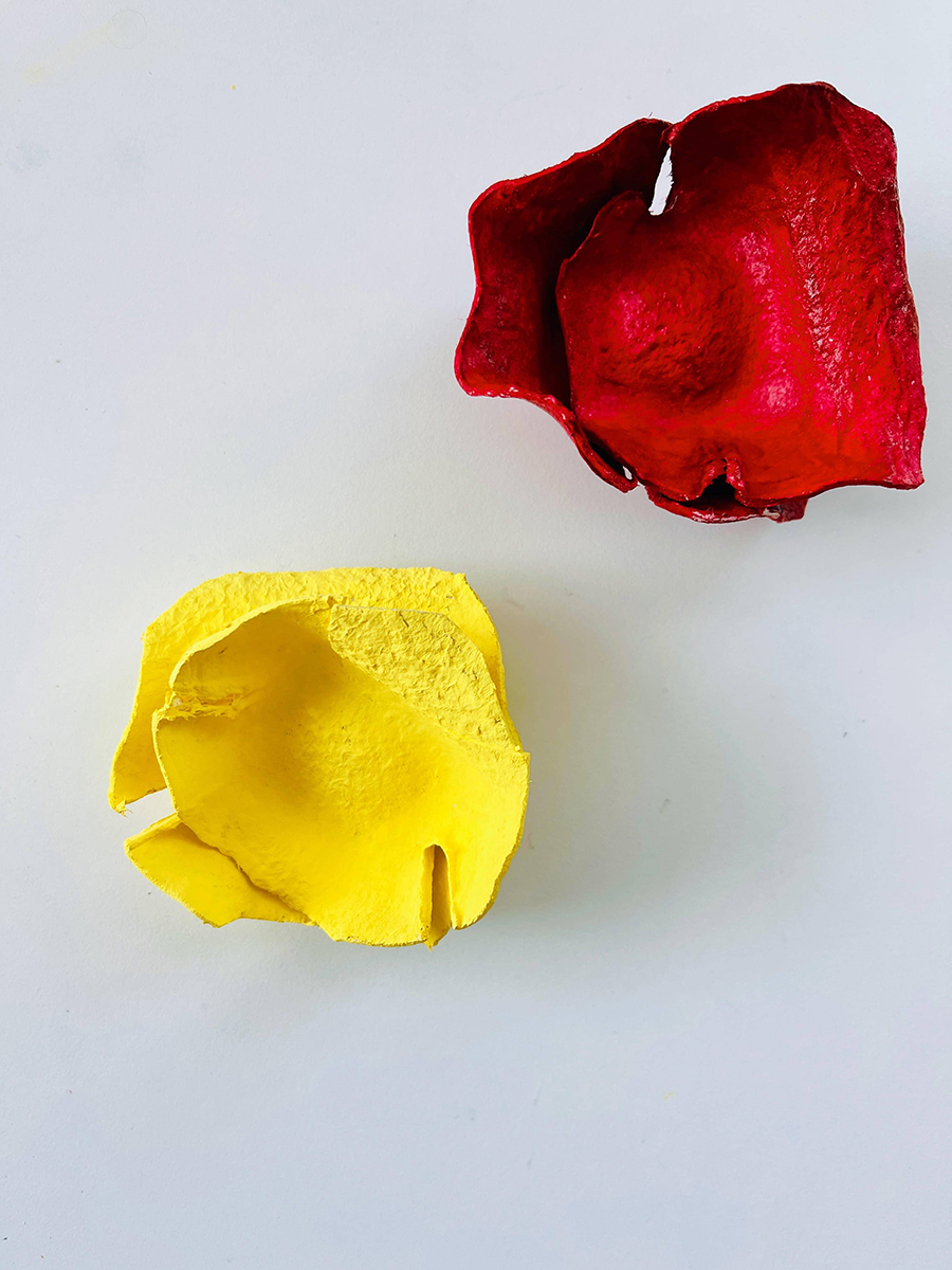 yellow and red painted egg carton flower