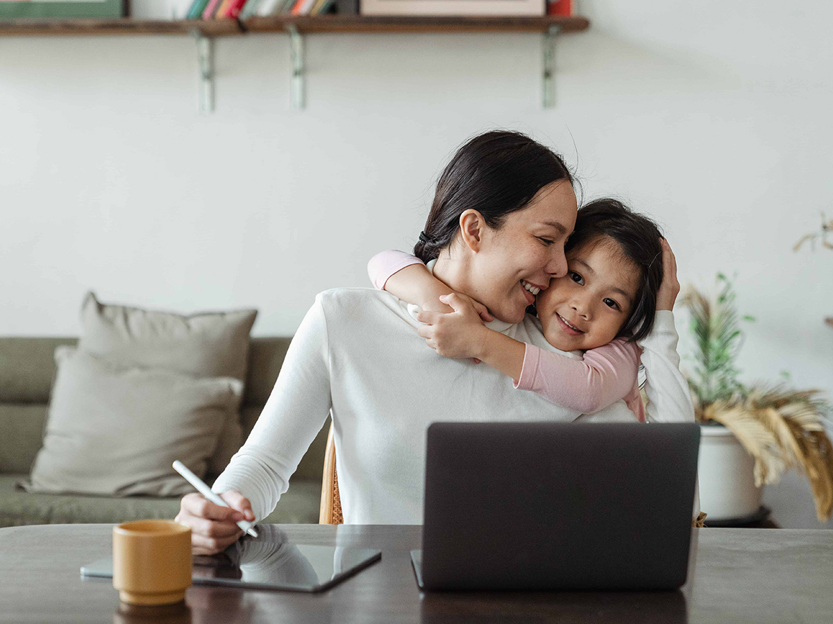 mom taking care of herself and her child while working