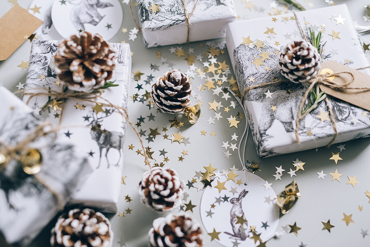 creative gift wrapping with pinecone gift toppers