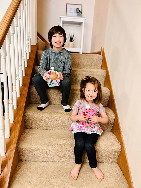 kids holding reusable food pouches