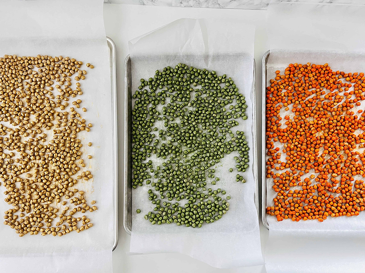 colorful painted chickpeas on parchment paper