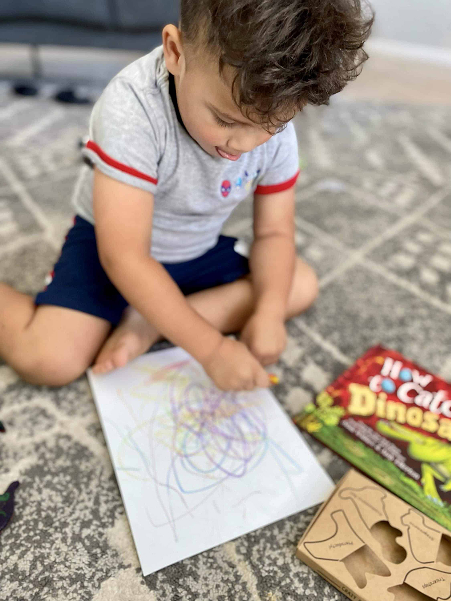 toddler engaging in sensory play