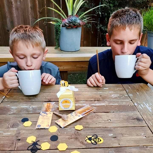 two boys engaging in a sensory tea time food play activity