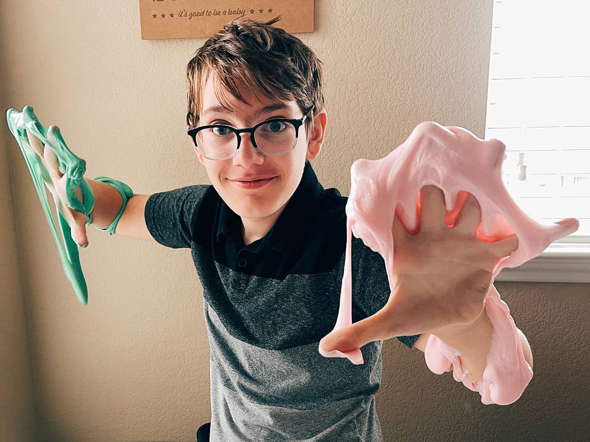 kid playing with slime made with no glue