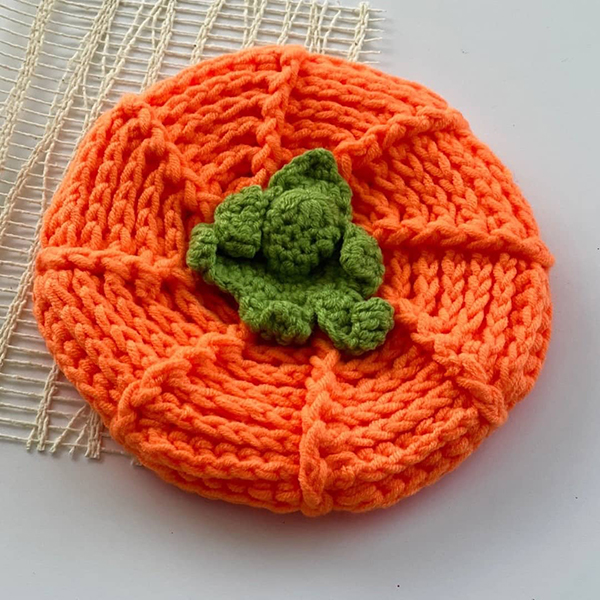 orange knit pumpkin hat from the October 2023 Howdy Baby subscription box