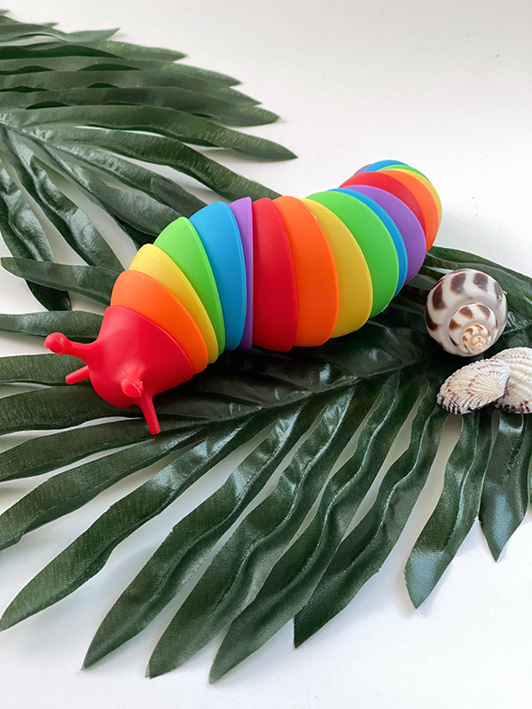 rainbow sensory slug toy from the jungle themed Howdy Baby subscription box for girls and boys