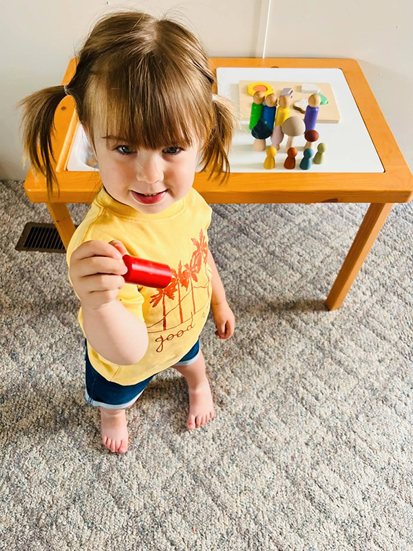 little girl wearing a good vibes t shirt from the May 2023 Howdy Baby subscription box for mother's day