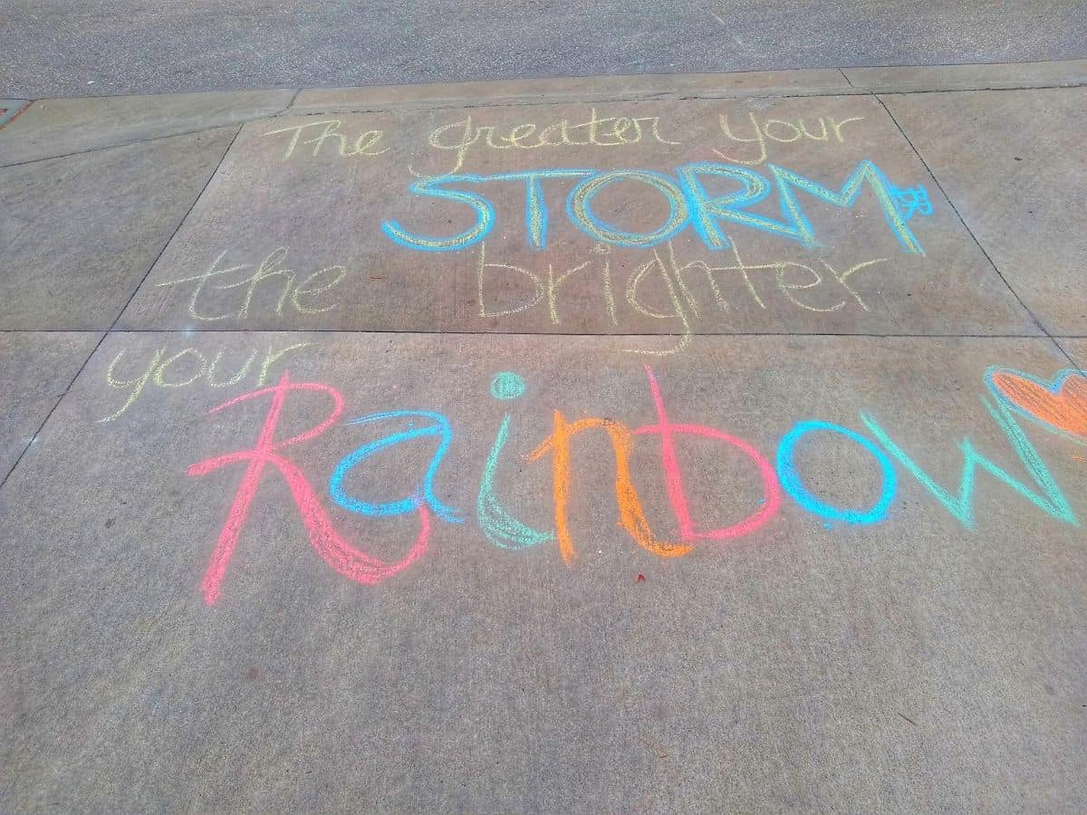the greater your storm the brighter your rainbow inspirational sidewalk chalk quote