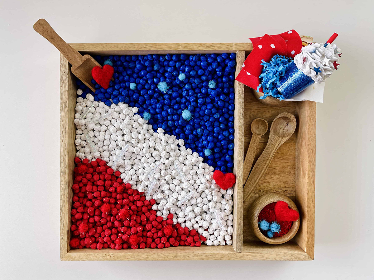 red white and blue toddler sensory bin