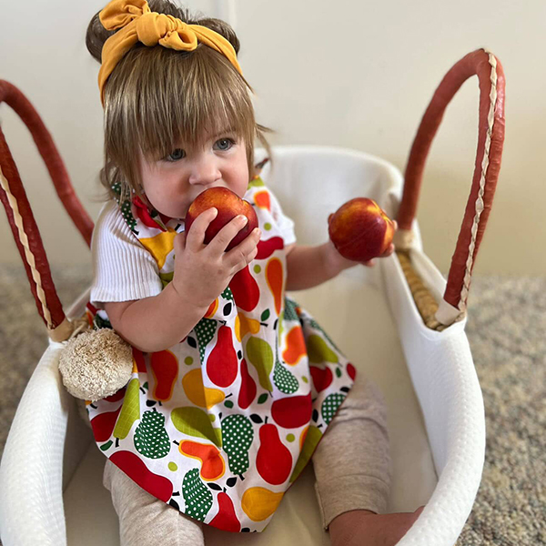 little girl eating apples