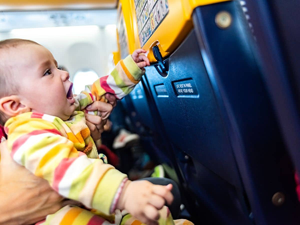 parents traveling with toddlers on a plane