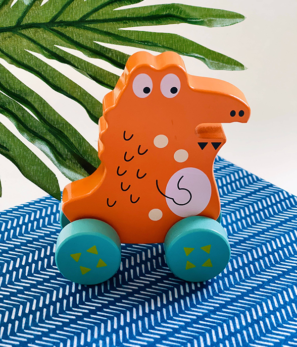 orange wooden alligator push toy