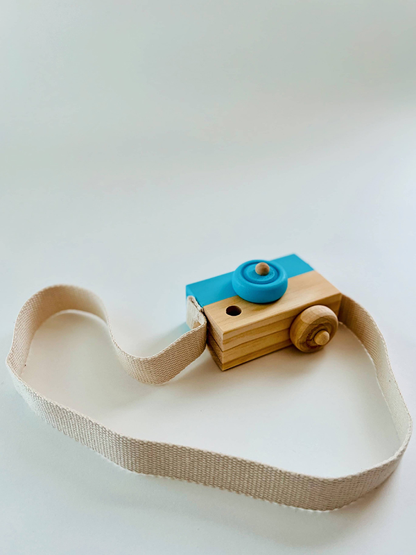 wooden camera toy from the August 2022 Howdy Baby subscription box for new moms