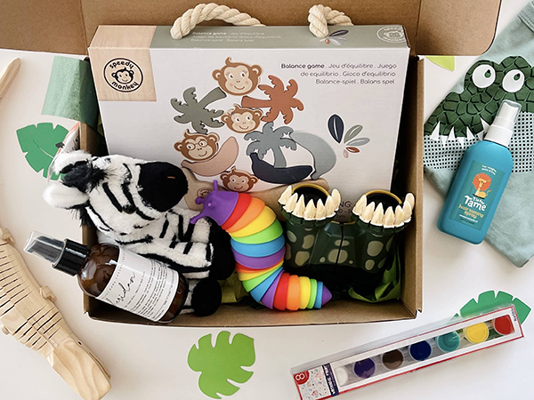 Howdy Baby kids box with animal balance game, wooden crocodile toy, and alligator t-shirt