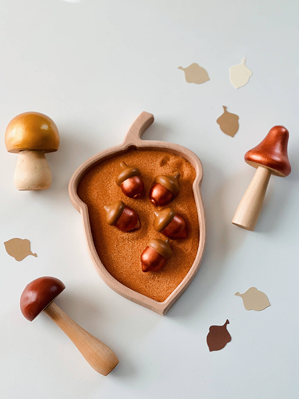 wooden Montessori sorting tray with wooden mushroom toys